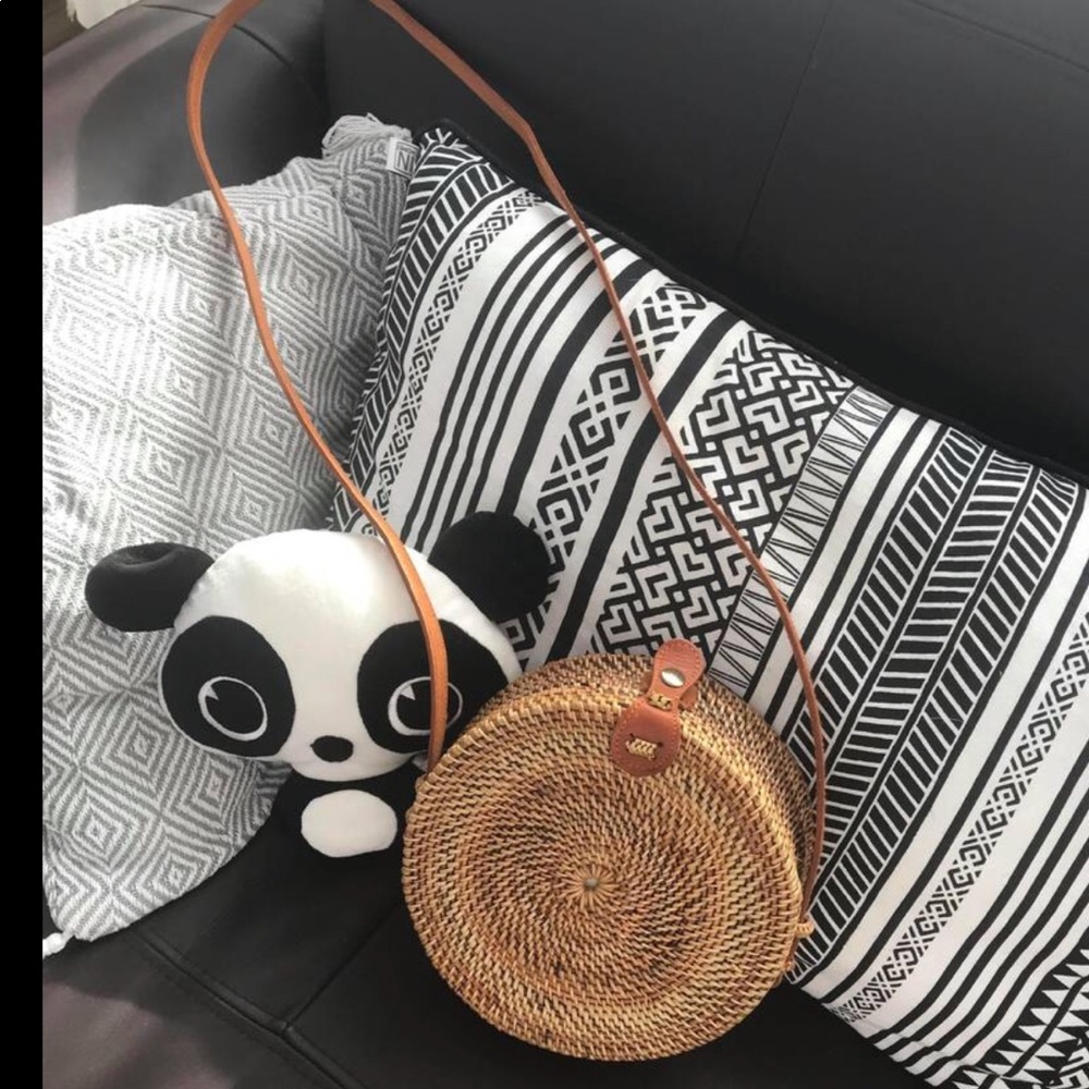 Round Rattan Bag with Leather handles.